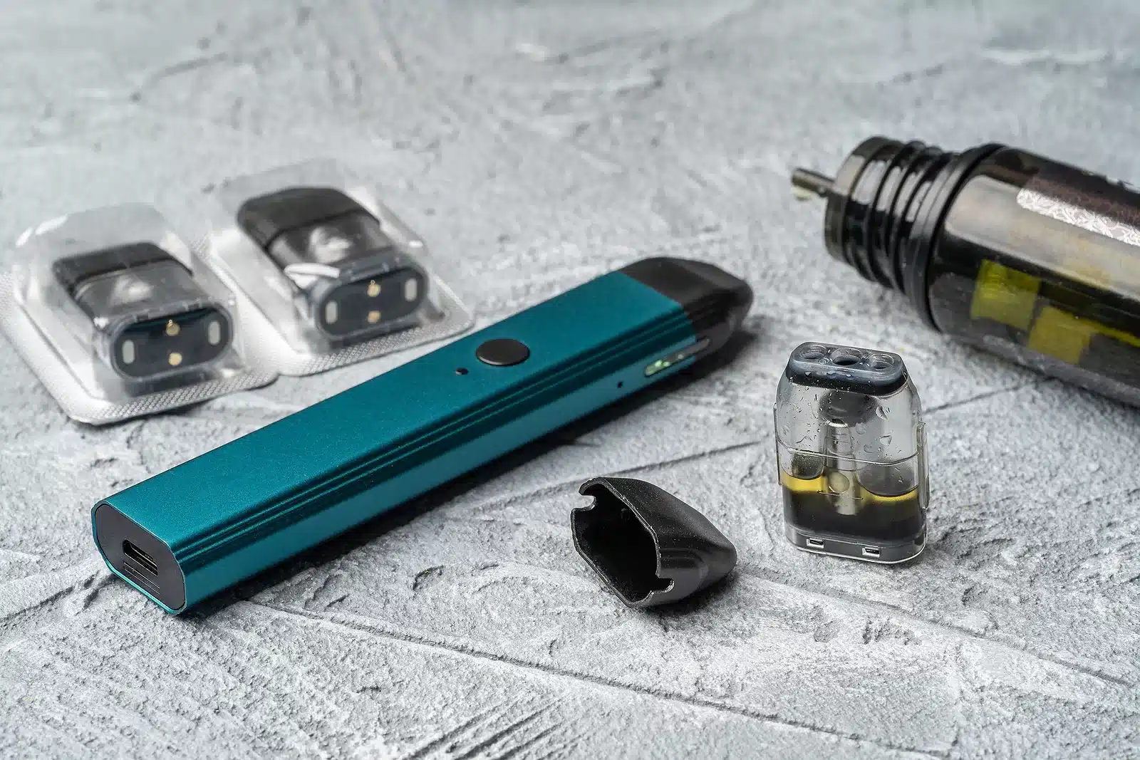 Vape Pod System And Replacement Cartridges Filled With E-juice O